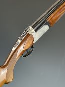 Italian 12 bore over and under shotgun with engraved locks, underside and thumb lever, chequered