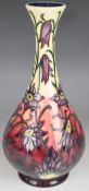 Moorcroft pedestal vase decorated in the Pasque Flower pattern, dated 2000 to base, H32cm