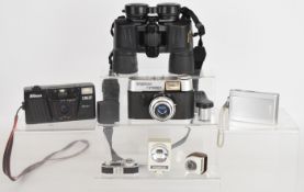 Cameras and binoculars to include a cased pair of Nikon Action EX 8x40 waterproof binoculars, Sony