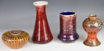 Four Cobridge Stoneware pottery vases, two with flambé glazes, tallest 23cm