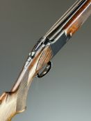 Browning B25 A1 12 bore over and under ejector shotgun with chequered semi-pistol grip and forend,