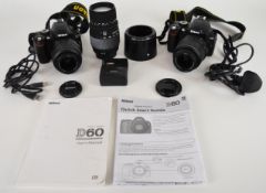 Two Nikon D60 digital SLR cameras, both with Nikon DX AF-S Nikkor 18-55mm 1:3.5-5.6 G, together with