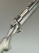 Mossberg 100 ATR .243 bolt-action rifle with composite stock, chequered semi-pistol grip and forend,