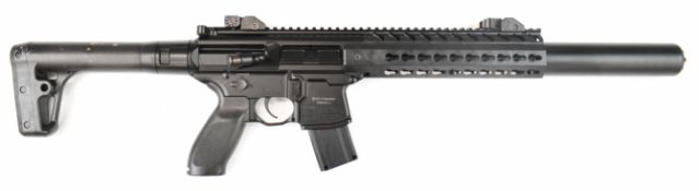 Sig Sauer .177 CO2 assault style air rifle with textured pistol grip, multi-shot magazine, sound