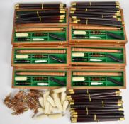 A collection of shotgun cleaning items comprising six wooden cased cleaning kits, twenty 12, 16