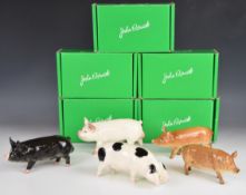 Five Beswick pig figures including Gloucester Old Spot, all boxed, tallest 10cm