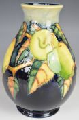 Moorcroft trial pedestal vase decorated with fruit, dated 99 to base, H19.5cm