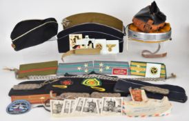 Military caps and insignia to include post war German, French and Royal Scots Guards British caps,