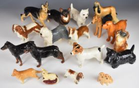 Eighteen mainly Beswick dog figures including Romany Rhinestone Bull Terrier, Cocker Spaniel,