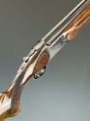 Miroku 12 bore over and under ejector shotgun with engraved locks, chequered semi-pistol grip and