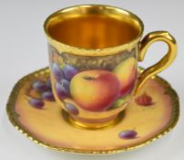 Royal Worcester painted fruit cabinet cup and saucer with decoration of peaches, grapes and
