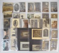 Approximately 160 German WW1 interest photographs and postcards, many used, to include studio
