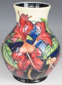 Moorcroft pedestal vase decorated in the Simeon pattern, dated 99 to base