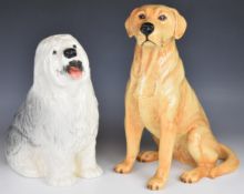 Two Beswick fireside dog figures comprising Old English Sheepdog and Labrador, tallest 34cm