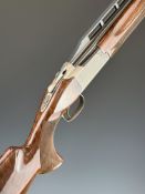 Browning B725 Trap 12 bore over and under ejector shotgun with engraved locks, chequered semi-pistol