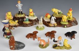 Two Beswick tree stump stands and animal figures, Royal Doulton Winnie The Pooh figures etc, tallest