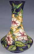 Moorcroft trial pedestal vase with floral decoration, dated 03 to base, H21cm