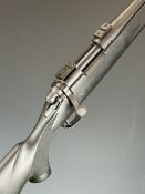Remington Model 700 .243 bolt-action rifle with composite stock, chequered semi-pistol grip and