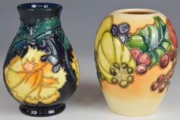 Two Moorcroft vases with fruit and foliage decoration, one signed Kerry Goodwin 2002, the other