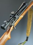 Ruger M77 Mark II .223 Remington bolt-action rifle with laminate show wood stock, semi-pistol