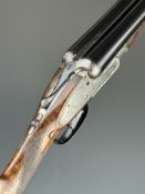 A Lancaster 12 bore sidelock side by side ejector shotgun with named and engraved locks, scrolling