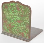Tiffany Studios New York bronze and glass bookend with pierced decoration over glass panel (14 x