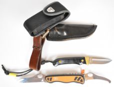 Two knives comprising Shrade PH2 hunting knife, with black and brass grips, overall length 17.5cm,