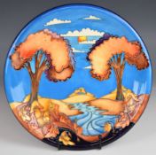 Moorcroft charger decorated in the Wanderers Sky pattern, dated 2002, diameter 26cm