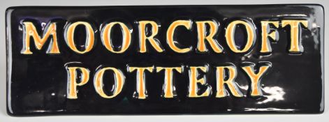 Moorcroft Pottery advertising sign decorated verso with passion flowers, dated 2001 to base, L18.5 x