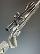 Browning X-Bolt .22-250 bolt-action rifle with GRS laminate show wood stock, shaped grip, adjustable