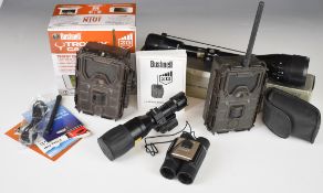 A collection of gun and shooting related items comprising two Bushnell Trophy Cam HD trail