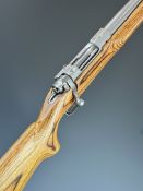 Ruger M77 Mk.II .204 bolt-action rifle with laminate show wood stock, semi-pistol grip, sling mounts
