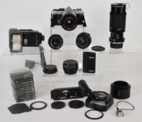 Olympus OM-2N 35mm SLR camera with Olympus Zuiko MC Auto-S 1:1.8 f=50mm, Tokina 24mm 1:2.8, Sirius