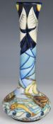 Moorcroft pedestal vase decorated in the Winds of Change pattern, dated 99 to base, H21cm