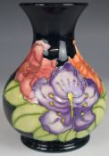 Moorcroft pedestal vase decorated with multicoloured flowers, dated 96 to base, H16.5cm