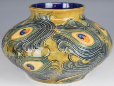 Moorcroft squat pedestal vase decorated with feathers in the Phoenix pattern, dated 99 to base,