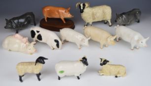 Twelve Beswick / Royal Doulton pig and sheep figures including Gloucester Old Spot, tallest 14cm