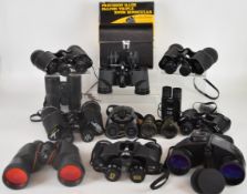 Twelve pairs of binoculars to include Opticron Discovery waterproof 8x42, Tasco waterproof 7x50,