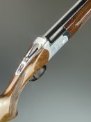 Sarraguarte 12 bore over and under ejector shotgun with engraved locks and underside, chequered