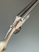 Thomas Wild 12 bore side by side shotgun with named locks and engraved locks, engraved underside,