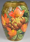 Moorcroft vase decorated in the Flame of the Forest pattern, dated 97 to base, H14cm