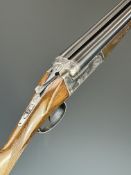 Arizaga 20 bore side by side shotgun with engraving of dogs to the locks, chequered grip and forend,
