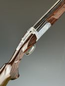 Fausti 12 bore over and under ejector shotgun with engraved scenes of birds to the action, named