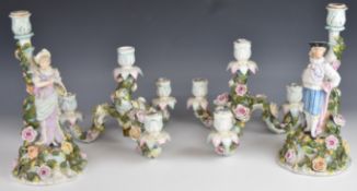 Volkstedt pair of figural candelabra with applied flower decoration, H50cm