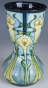 Moorcroft waisted vase decorated in the Canna Lily pattern, dated 2001 to base, H18.5cm