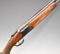 Baikal 12 bore over and under shotgun with engraved lock, underside, trigger guard and thumb