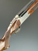 Browning 325 12 bore over and under ejector shotgun with named and engraved locks and underside,