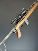 Ruger Model 10/22 .22 semi-automatic rifle with folding metal skeleton stock, wooden pistol grip,