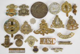 Military cap and other badges to include Hampshire Regiment, Royal Artillery, The Welch, Auxiliary