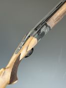 ATA 20 bore over and under shotgun with chequered semi-pistol grip and forend, vented top rib and 28